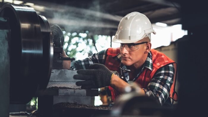 Smart Factory Worker Or Engineer Do Machine Job In A Manufacturing Workshop