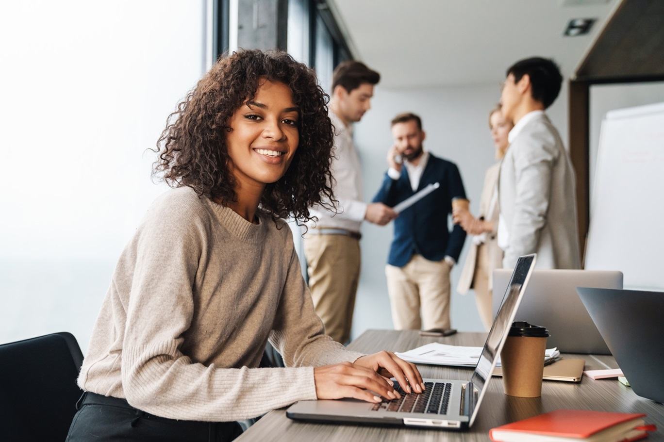 Women behind laptop